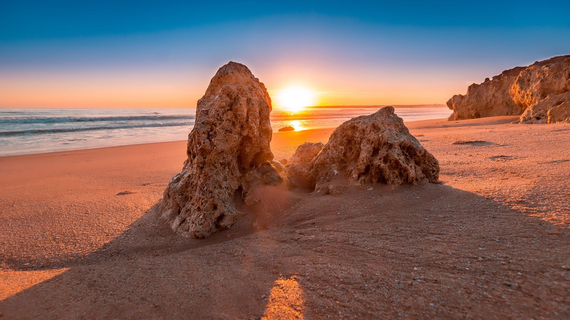 Golden hour light over lagoons, marshlands and Atlantic coastline on the eastern Algarve
